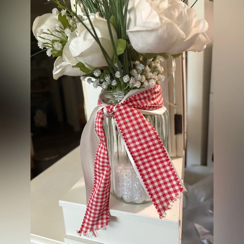 White Floral Arrangement in Glass Jar with Red & White Ribbon